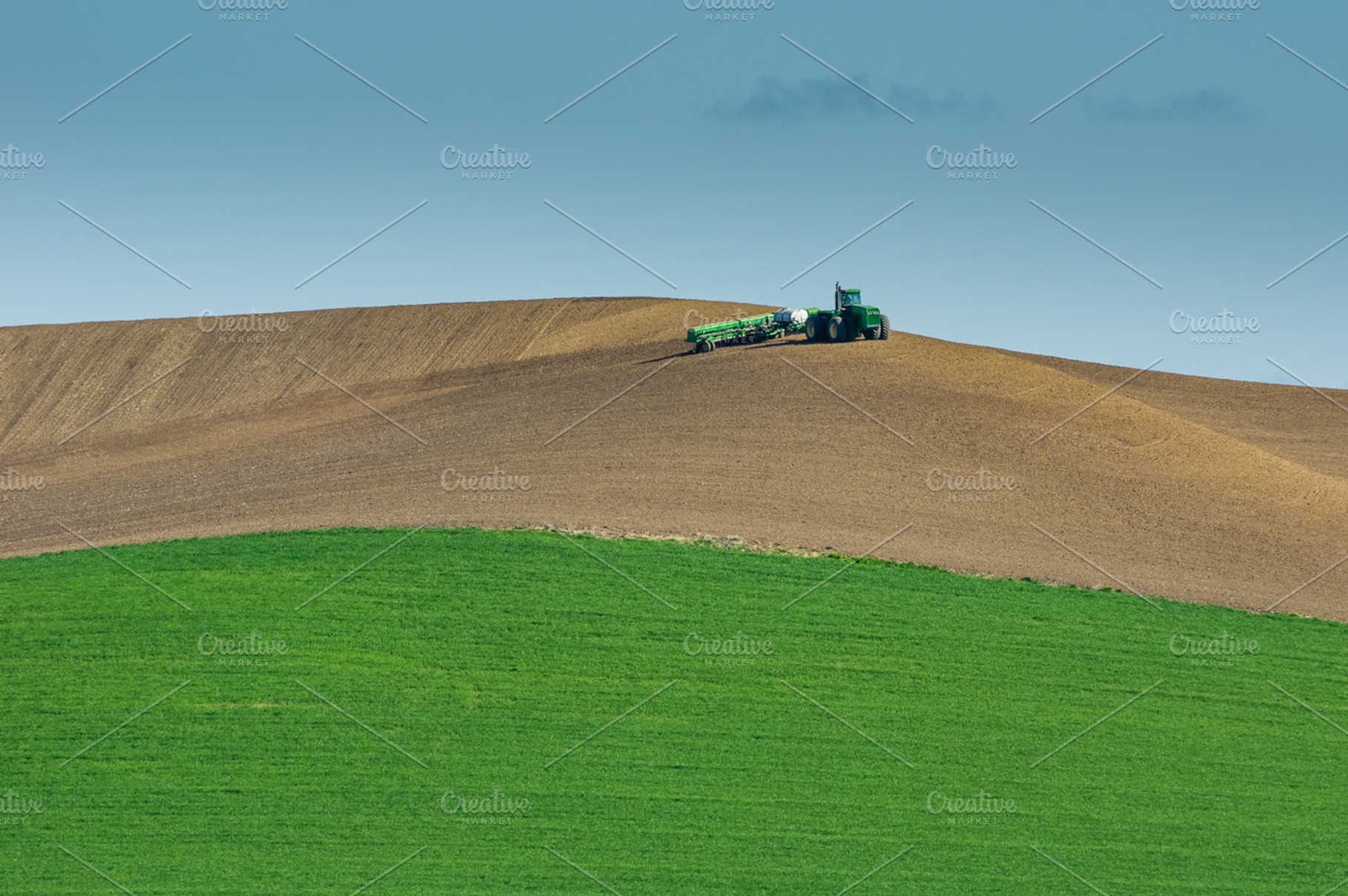 Tractor and planter working on a far