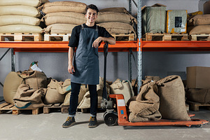 Smiling warehouse worker, a Person Photo by Artem Varnitsin