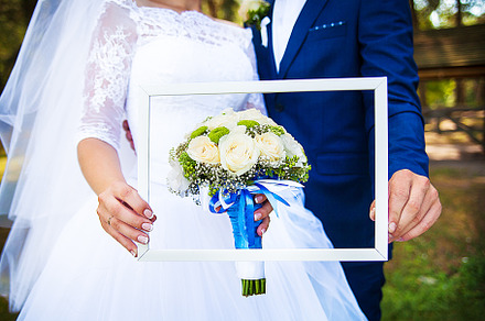 in the hands of newlyweds frame with a wedding bouquet, a Holiday Photo by Artsaba Family