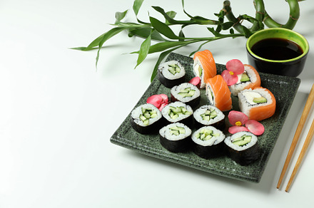 Concept of tasty food with sushi, space for text, a Food & Drink Photo by AtlasStudio