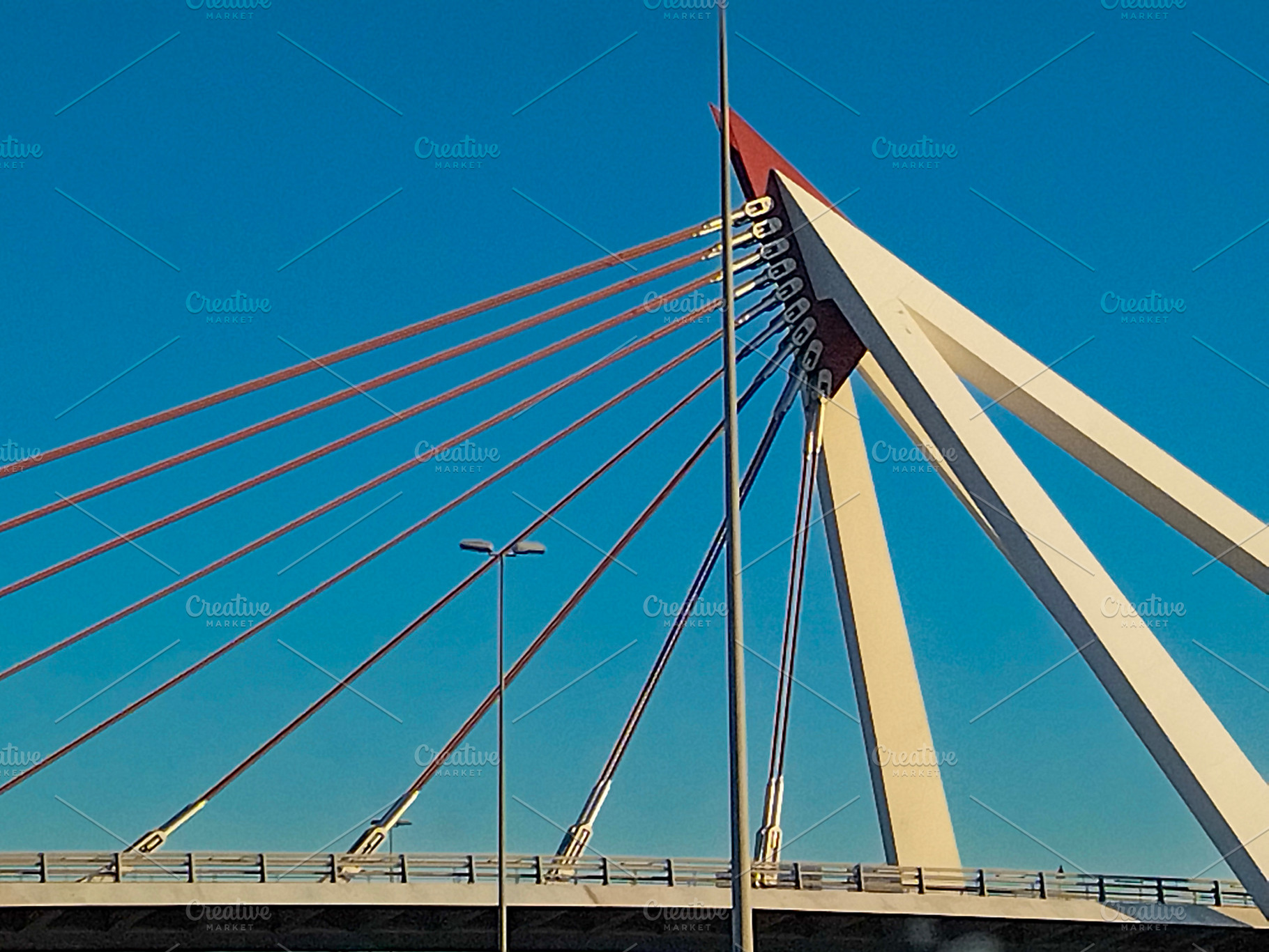 Cable-stayed bridge with red suspension cables, a Transportation Photo by DanFLCreativo