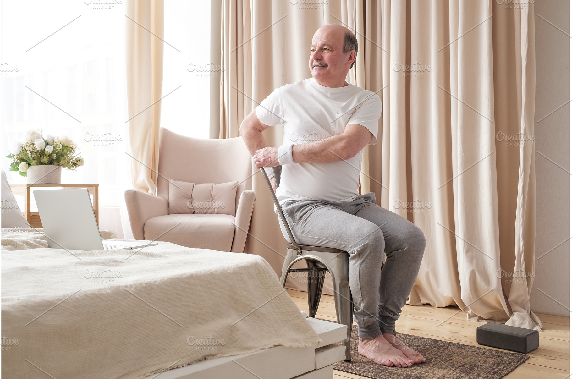 Sporty senior man practicing yoga, a Sports & Recreation Photo by Koldunov