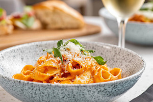 Creamy pasta garnished with fresh, a Food & Drink Photo by MistyDay