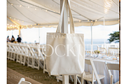 Beige Tote at Summer Event, a Product Mockup by MockupWizard (Thumbnail 1 of 3)