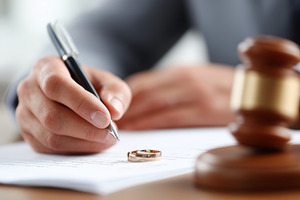 Close up of a man signing a divorce, a Business Photo by MistyDay