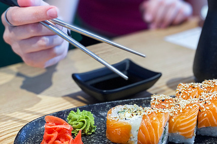 Eating roll sushi, a Food & Drink Photo by Olena Rudo