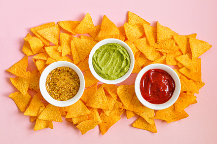 Corn tortilla chips and sauces., a Background Photo by Galiyah Assan