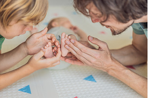 Father, son, and newborn baby lying, a Person Photo by Elizaveta Galitskaya