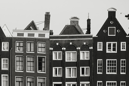 Black and white photo of beautiful medieval houses in Amsterdam, Netherlands, Europe., an Architecture Photo by Edalin's Store
