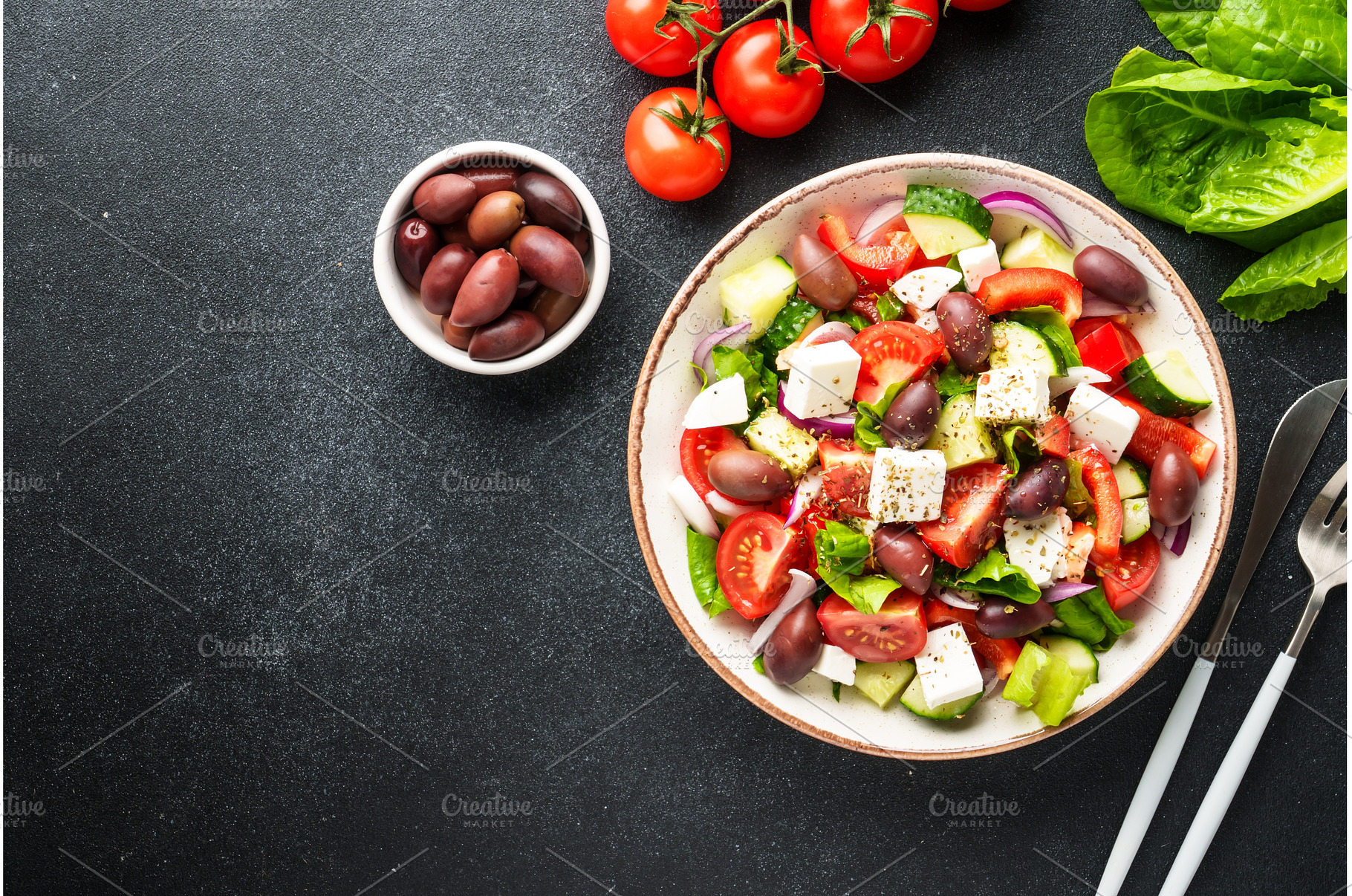 Greek salad in craft plate on black, a Food & Drink Photo by Nadia-nb
