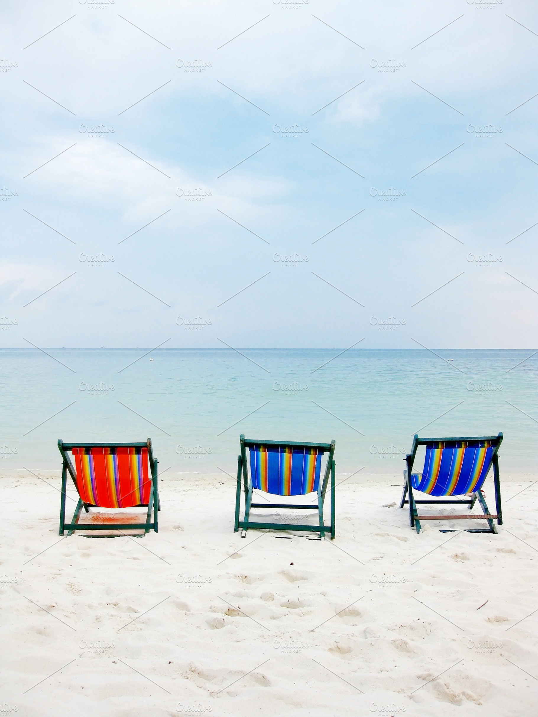 Deck Chair On The Beach For Three