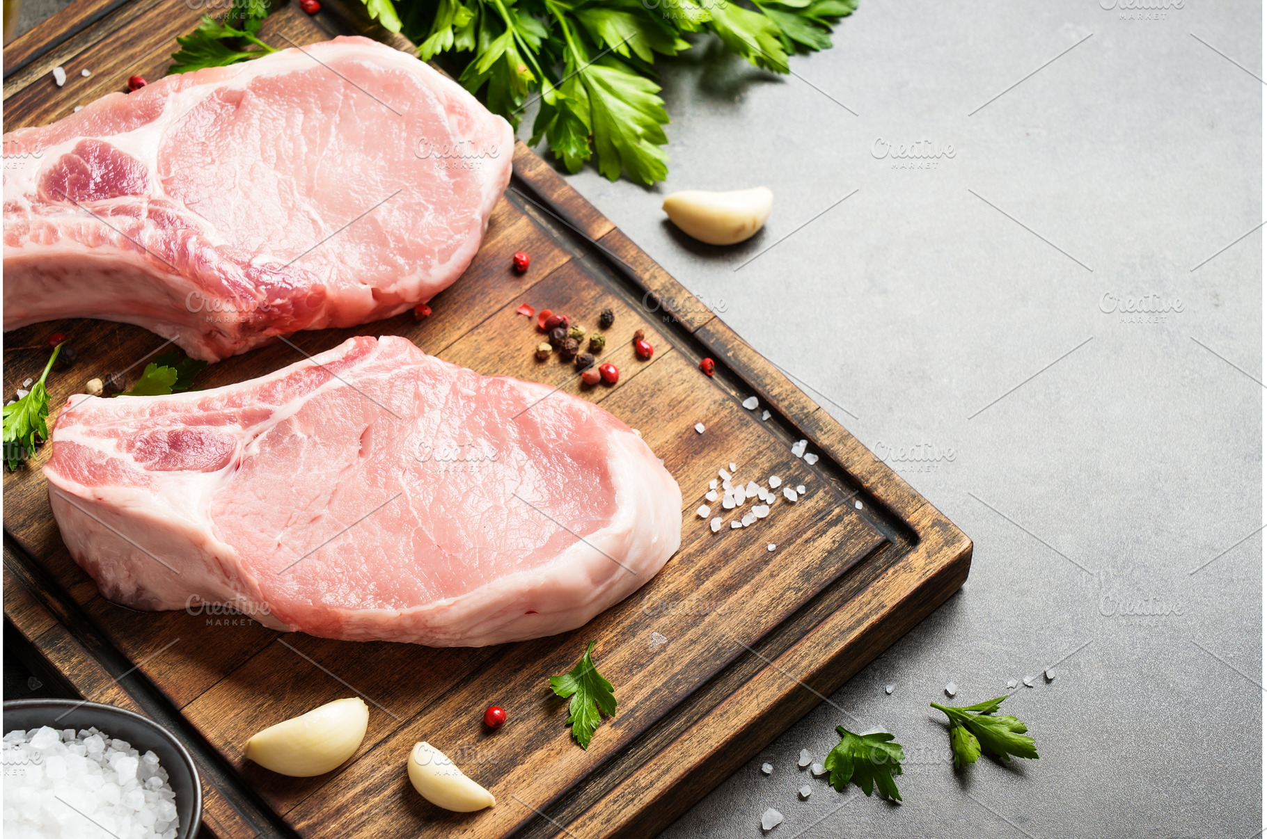 Raw pork meat on cutting board with, a Food & Drink Photo by Nadia-nb
