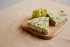 Delicious Cheese Danablu on a wooden board, side view. Copy spac, a Food & Drink Photo by LiudmylaChuhunova
