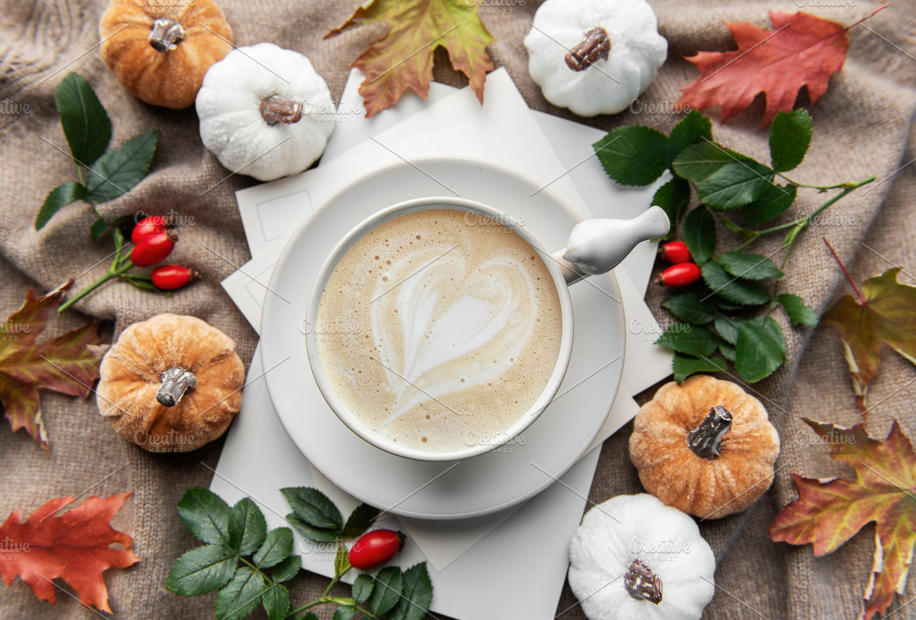 Autumn latte art heart with fall pumpkins and leaves, a Holiday Photo by Olena Rudo