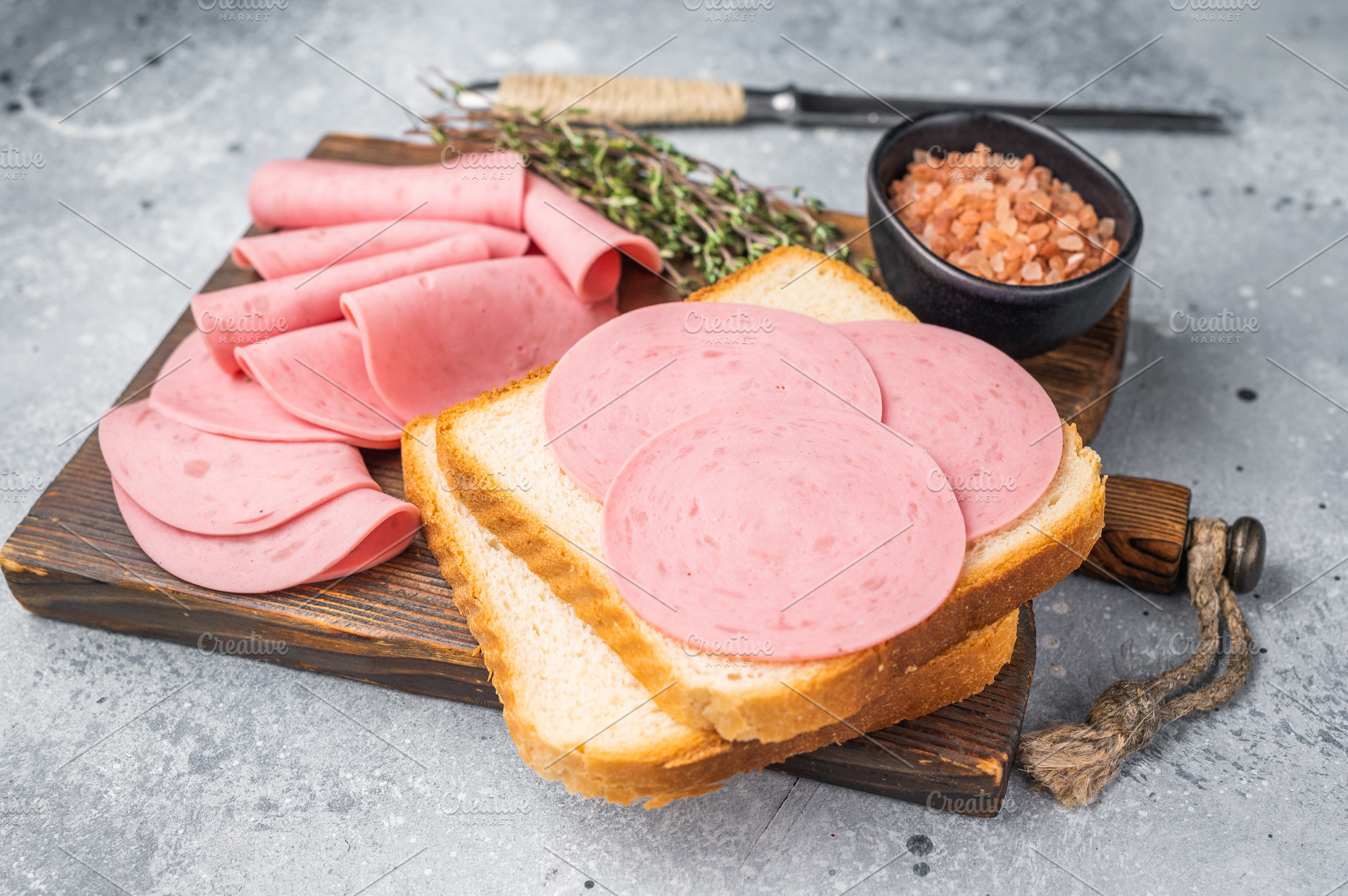 Slices of pink bologna lunch meat on toasted white bread with ro, a Food & Drink Photo by composter-box@mail.ru