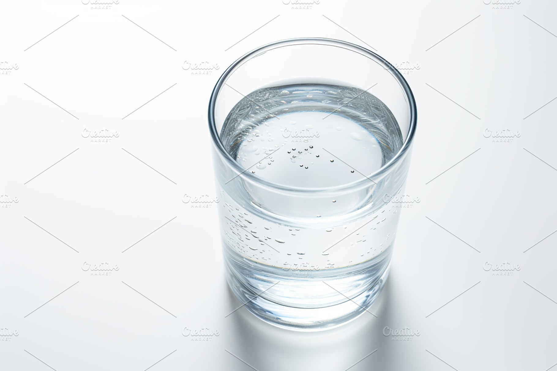Glass of water isolated on white background, a Food & Drink Photo by AlyaAnd