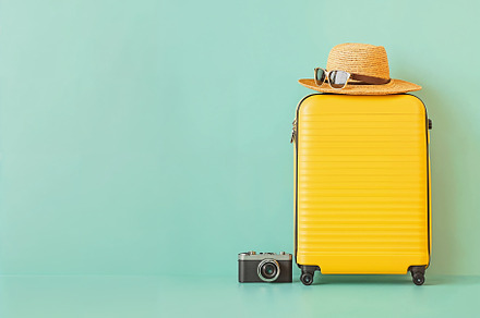 Bright yellow suitcase ready for tra, a Holiday Photo by OSORIOartist