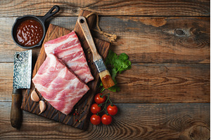 Raw pork ribs with spices, salt and, a Food & Drink Photo by Budarinphoto