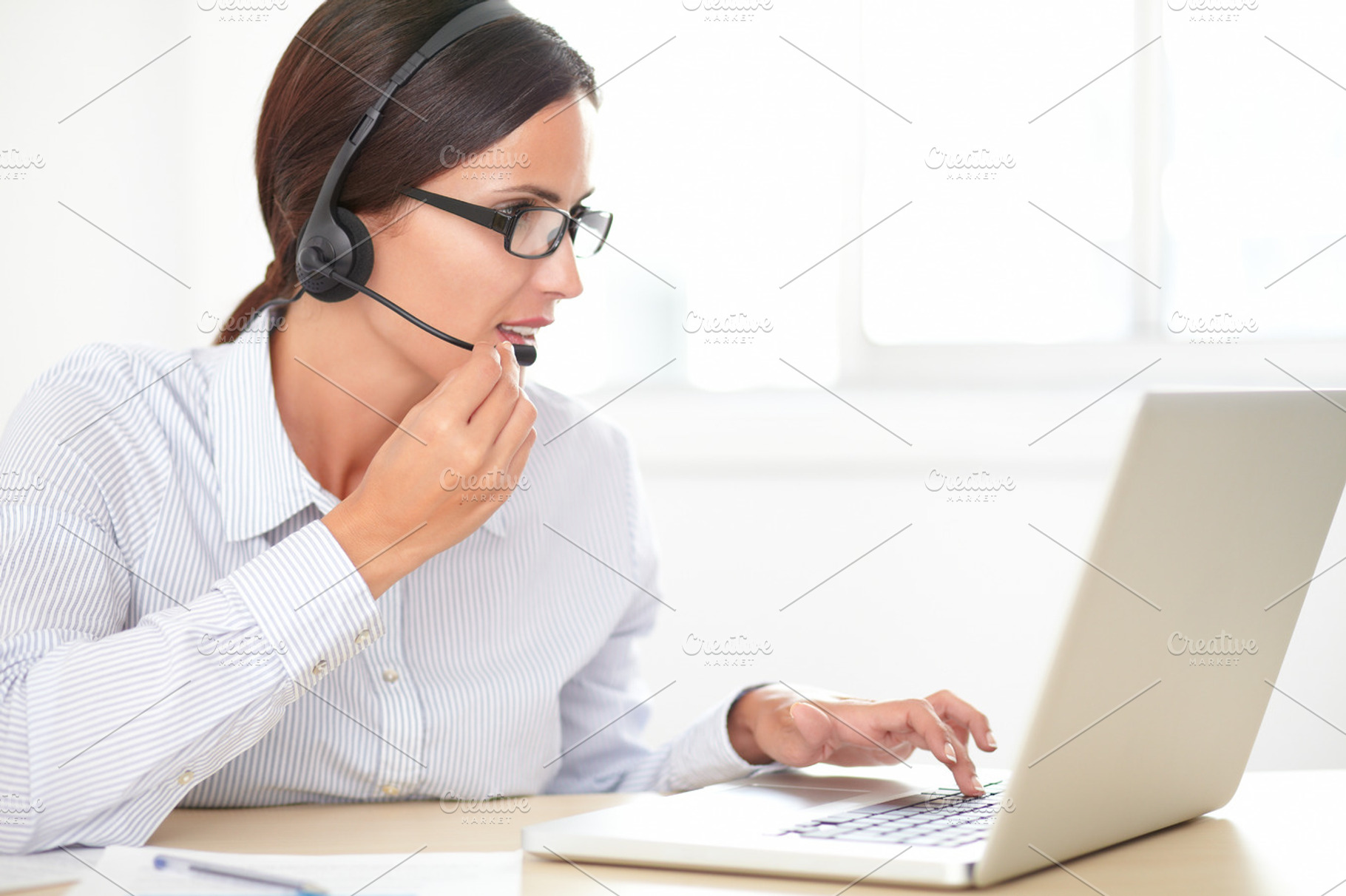 Businesswoman working at office featuring female, secretary, and spectacles, a Business Photo by Coco Images
