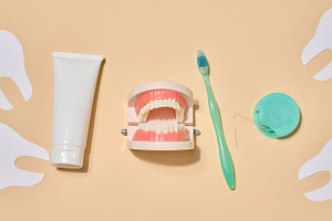 A tube of toothpaste, a toothbrush, dental floss, and decorative, a Health & Medical Photo by ndanko
