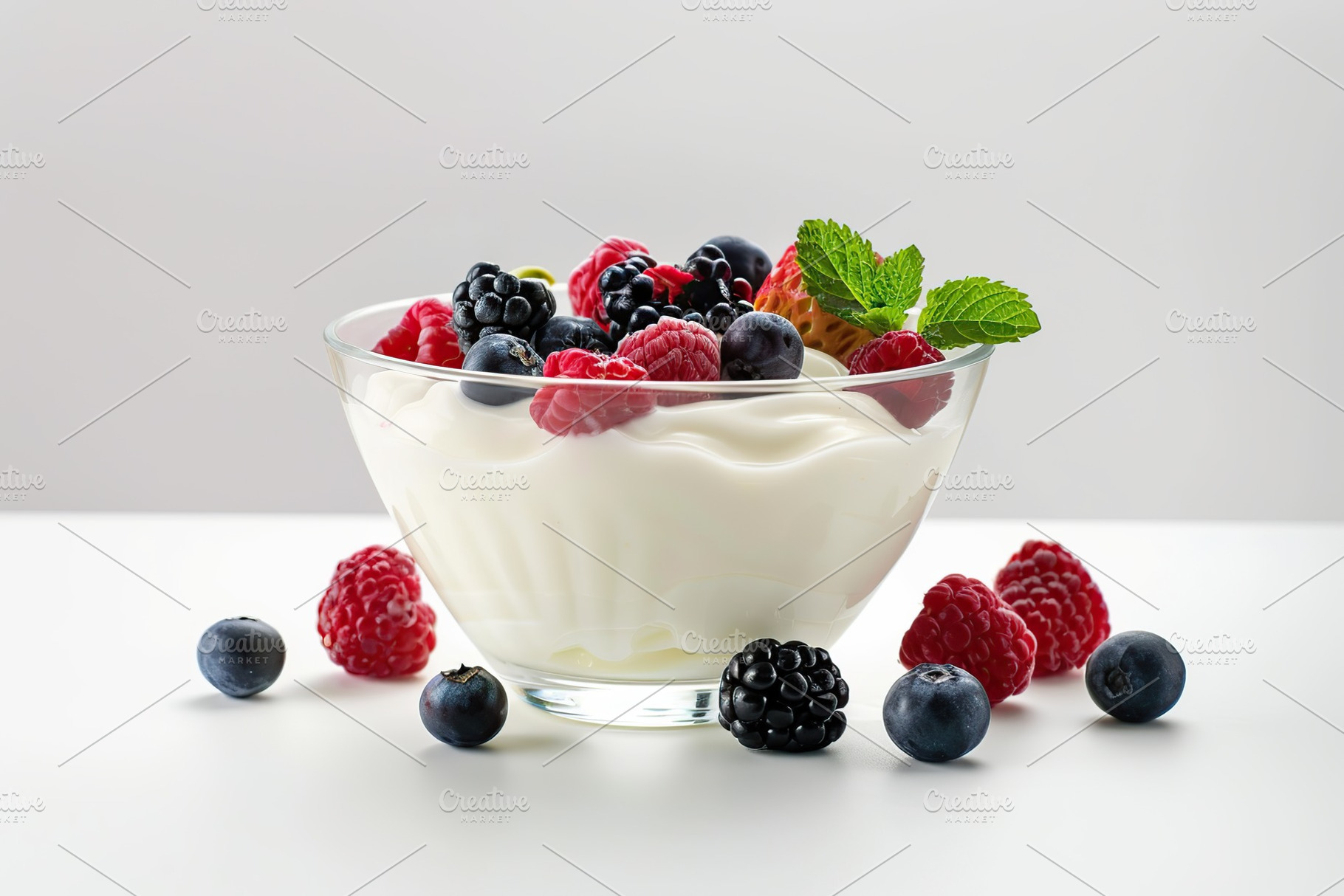 Bowl with fresh mixed berries and yogurt on white background, a Food & Drink Photo by AlyaAnd