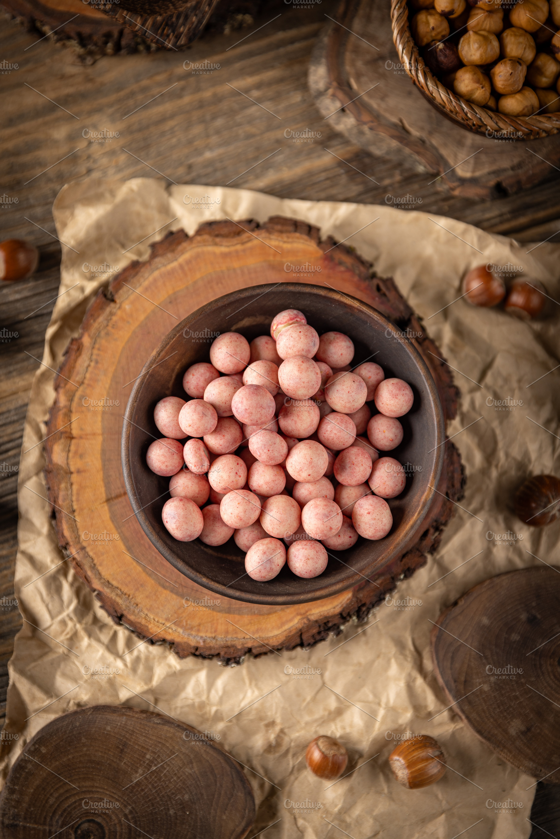 Bowl of raspberry flavour white chocolate covered hazelnuts, a Photo by Grafvision photography