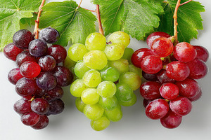 Trio of fresh grape bunches in red, green, and black with leaves, a Holiday Photo by José Manuel Gelpi