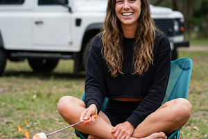 Happy Woman Roasting Marshmallows, a Holiday Photo by Virgo Studio