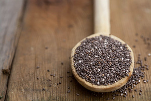 Chia on a wooden spoon featuring chia, omega, and healthy