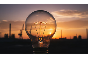 Close up of a glowing light bulb, an Industrial Photo by Igor Tichonow