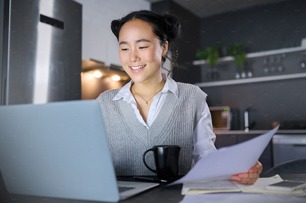 Finance documents, budget and Asian woman with laptop, paperwork and financial review for company startup. Accounting, remote work and female worker on computer for planning, kpi strategy and report, a Photo by Peopleimages.com