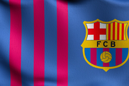 FC Barcelona flag blowing in the wind. Emblem of Football Club F, a Photo by Tampatra