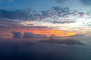 Aerial view of Moorea island at sunset, French Polynesia, a Photo by GoodGoods
