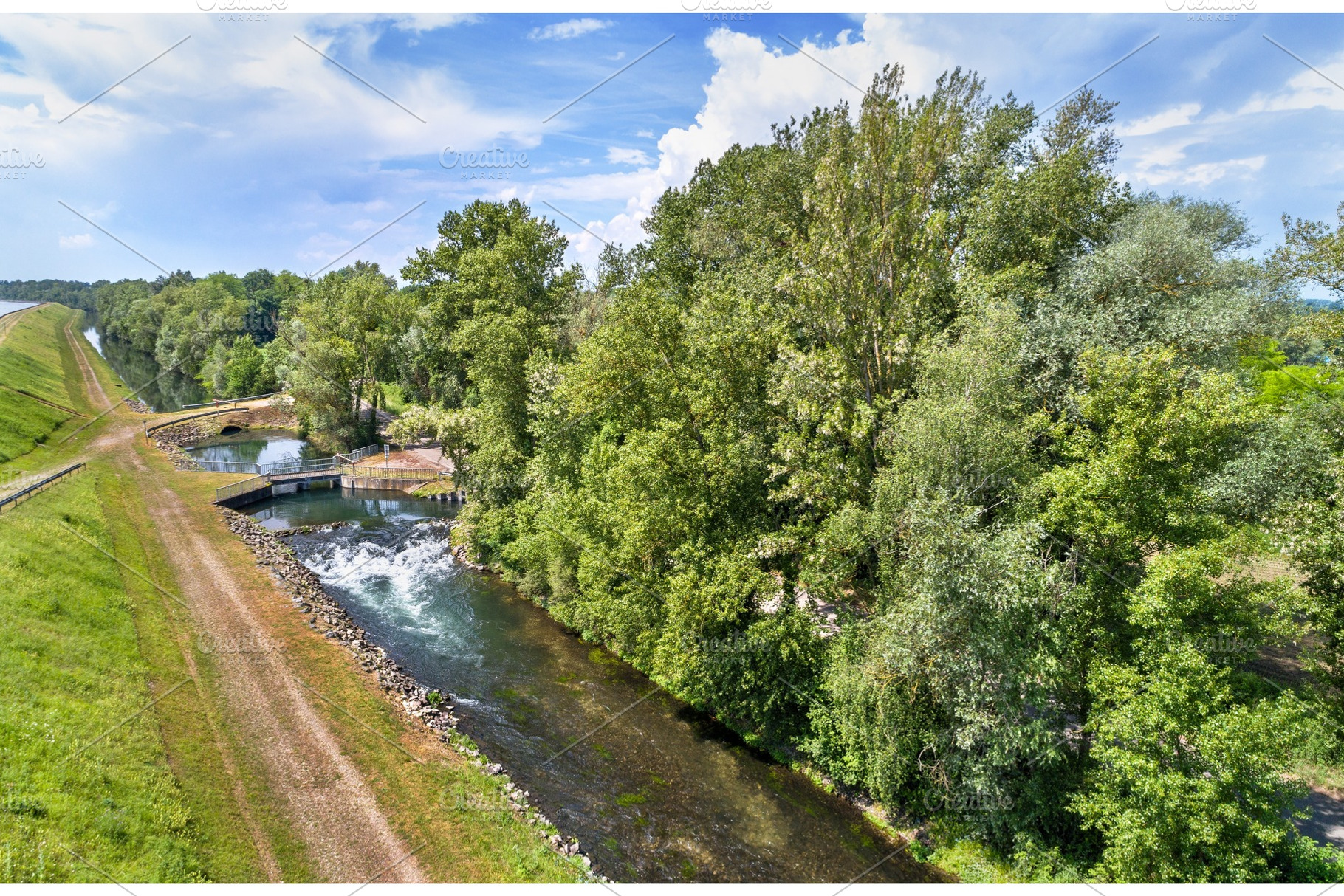 Small canal along the Rhine in Bas-Rhin, France, an Architecture Photo by Leonid Andronov