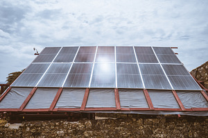 Rustic roof with solar panels, a Technology Photo by SkyNext