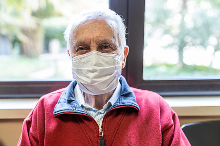 Elderly man in a hospital with respi containing person, hospital, and