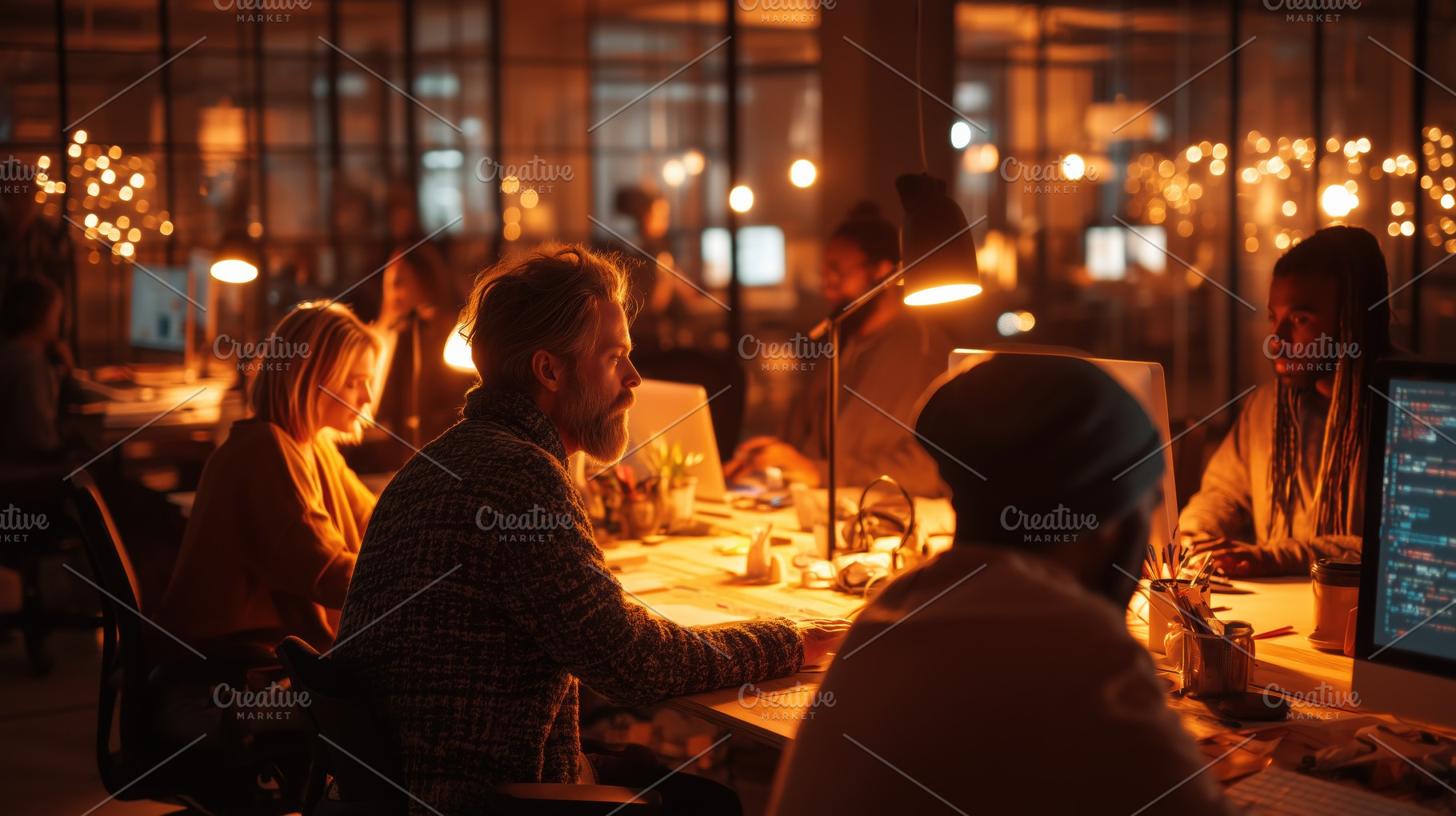 A dimly lit office space with several people working at desks. Warm light from, a Person Photo by Textures & Backgrounds