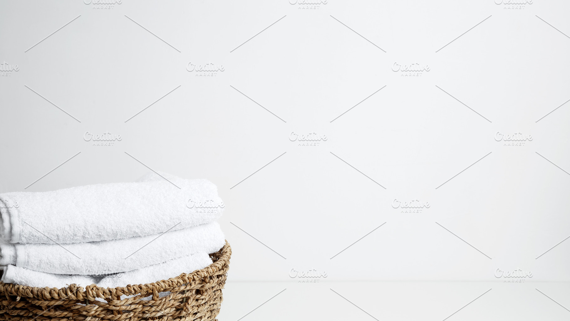 Household cleaning and hygiene concept packaging. Basket filled with clean whit, a Photo by matucha