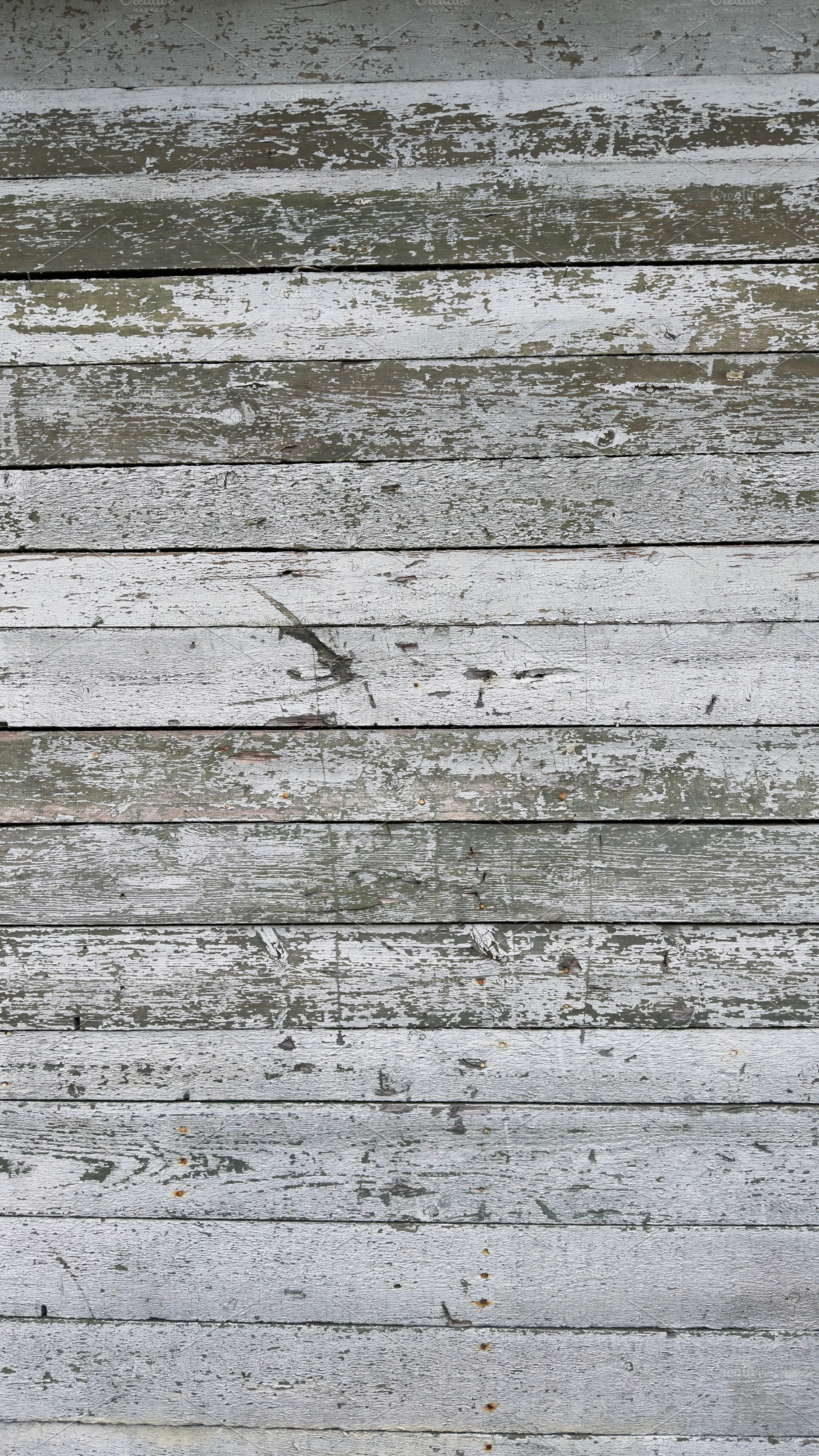 Weathered wooden planks with peeling paint in shades of white and gray, a Nature Photo by Textures & Backgrounds