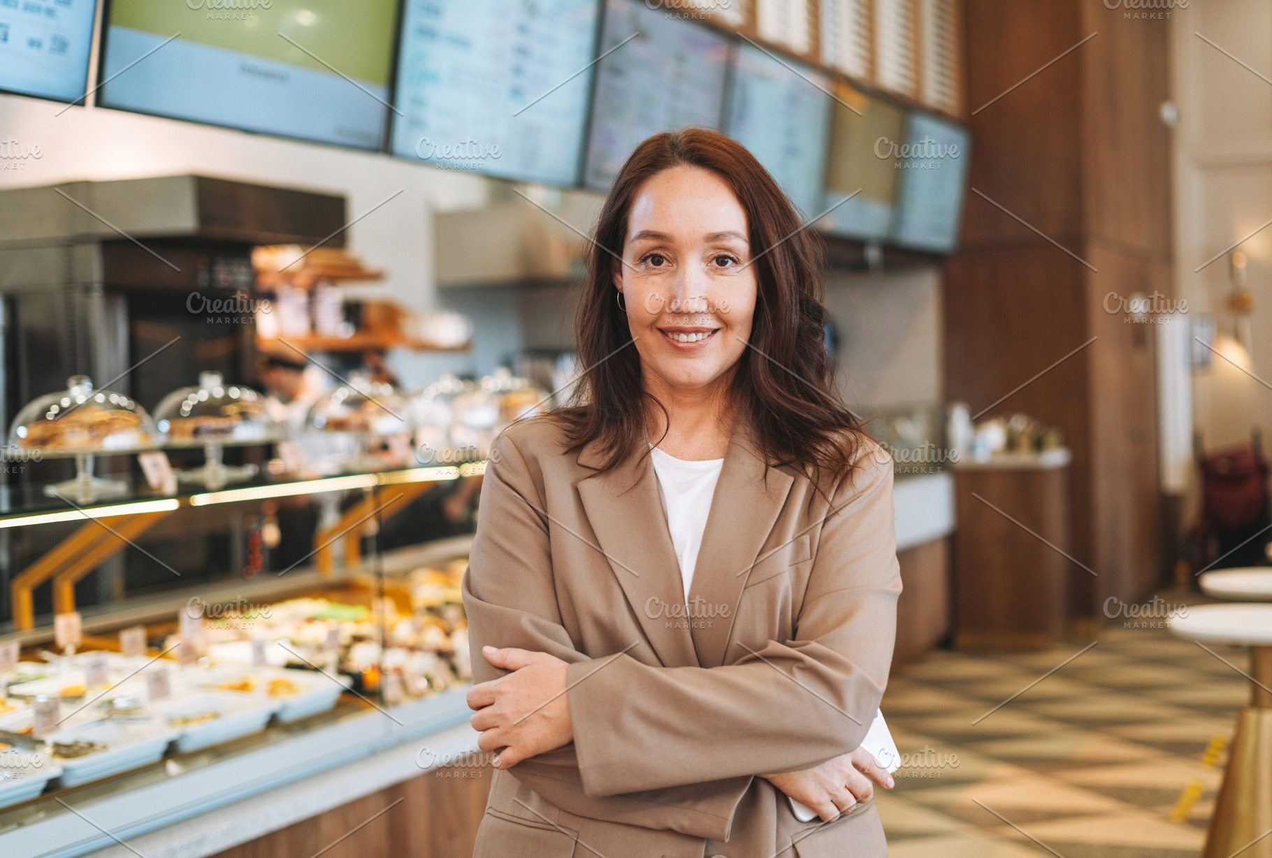 Young adult business woman in cafe, a Business Photo by Galina_Zhigalova