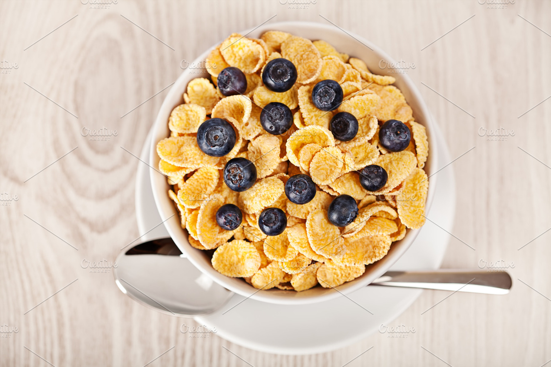 Corn flakes with blueberries breakfast stock photo containing background and