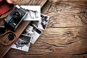 Old rangefinder camera and black-and-white photos.