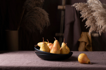 Sweet pears in rustic style on the dark background, a Food & Drink Photo by oxana.denezhkina