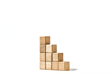 Wood cubes stacked as stair step shapes on white, a Business Photo by 1981 Rustic studio kan