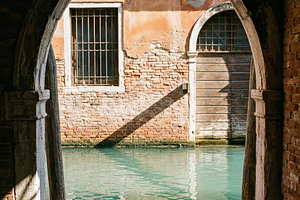 Ginger cat resting on a wooden pier, an Architecture Photo by Virgo Studio