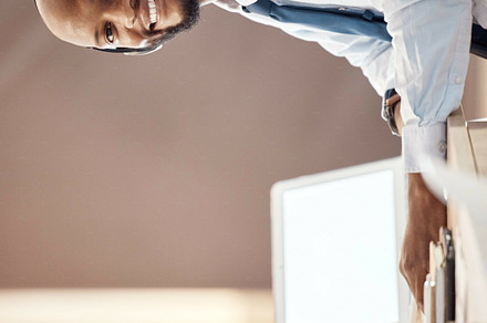 Blank computer screen, call center and portrait of black man on a telemarketing office call. Customer service, web support and contact us employee with a smile from online consulting job and career, a Photo by Peopleimages.com