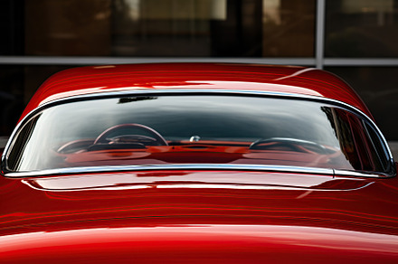Closeup photo of a new red modern car, a Transportation Photo by AlyaAnd