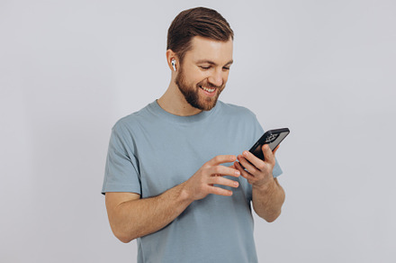 Happy bearded man dancing with earphones, listening music in hea, a Technology Photo by Cherkas Photography
