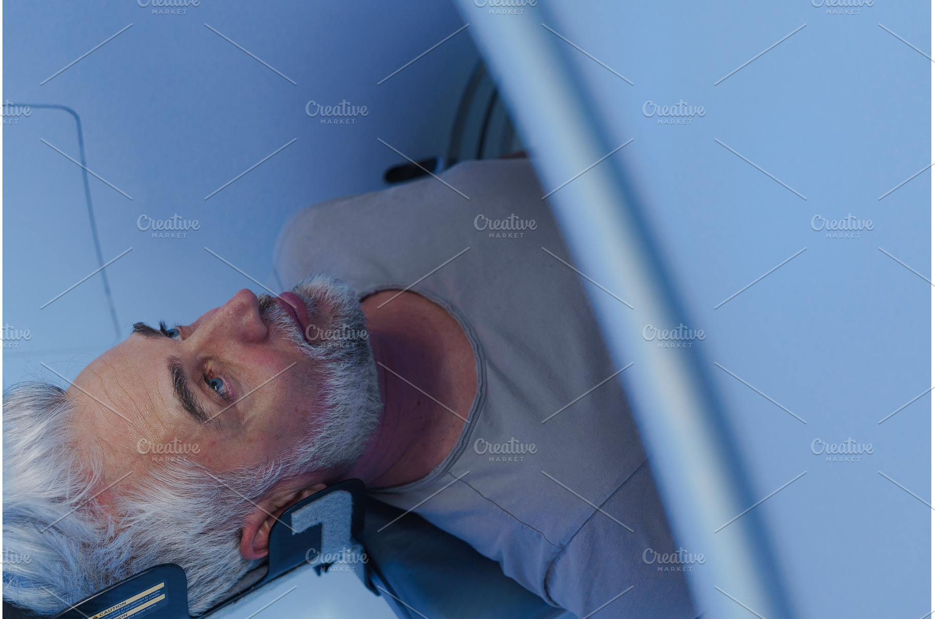 Male patient undergoing CT scan, a Health & Medical Photo by HalfPoint