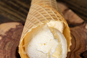 waffle cup with ice cream, sweet vanilla ice cream, a Photo by rsoollAI